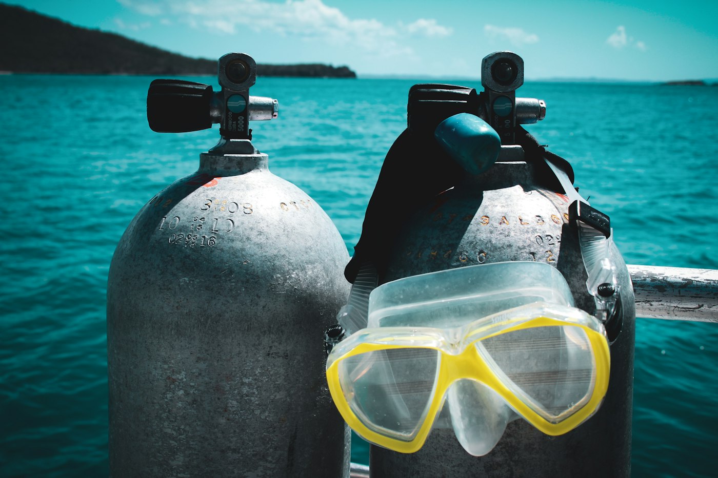 Scuba goggles resting on two buoys