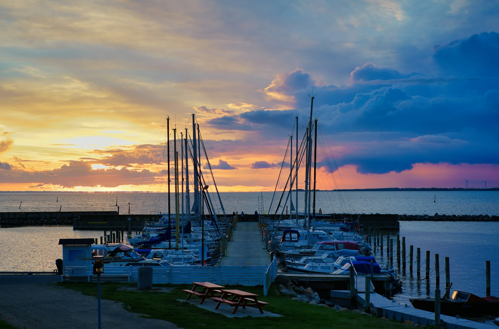 A marina full of boats at sunset