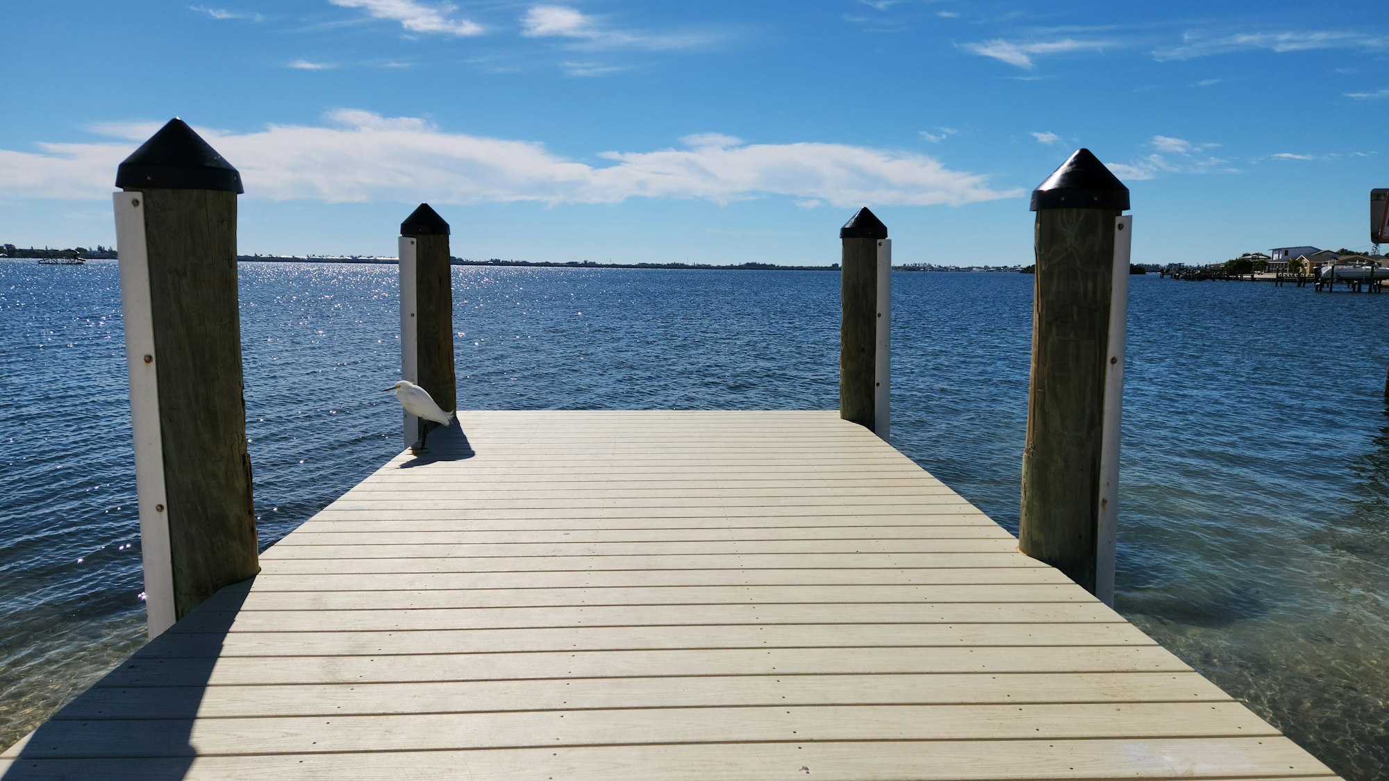 A wooden dock extending out over calm water