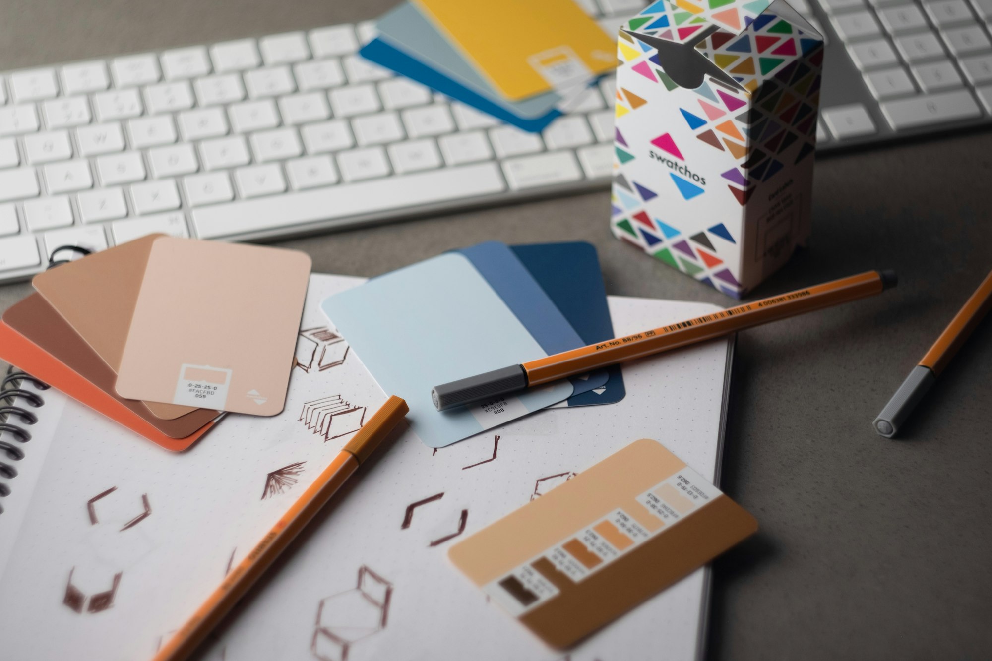 Color swatch cards on a design desk