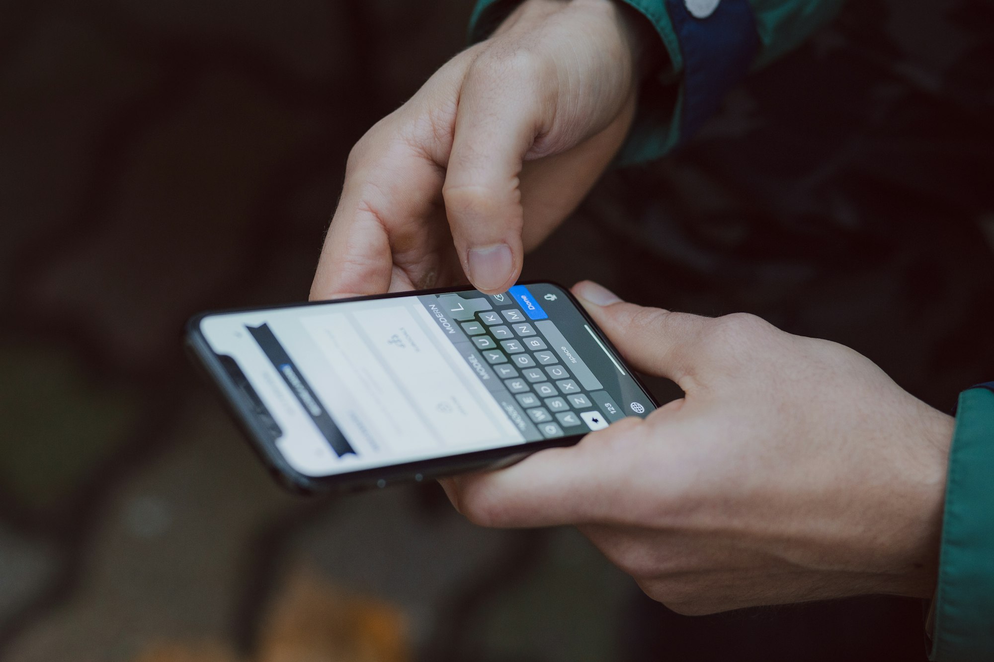 A person reading messages on a smartphone