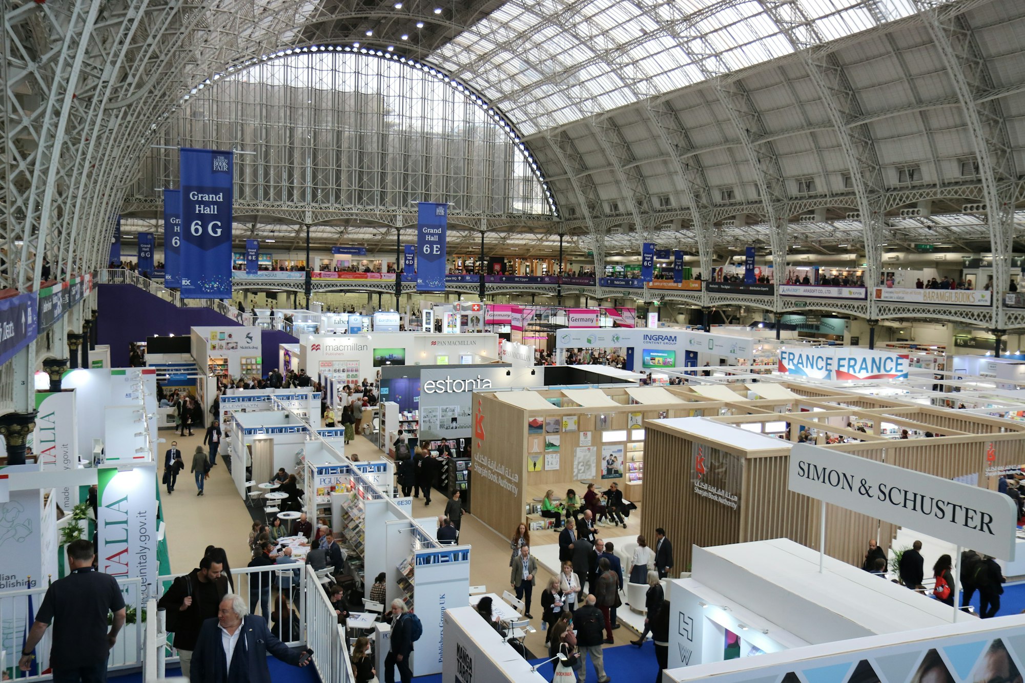 A busy exhibition hall full of booths