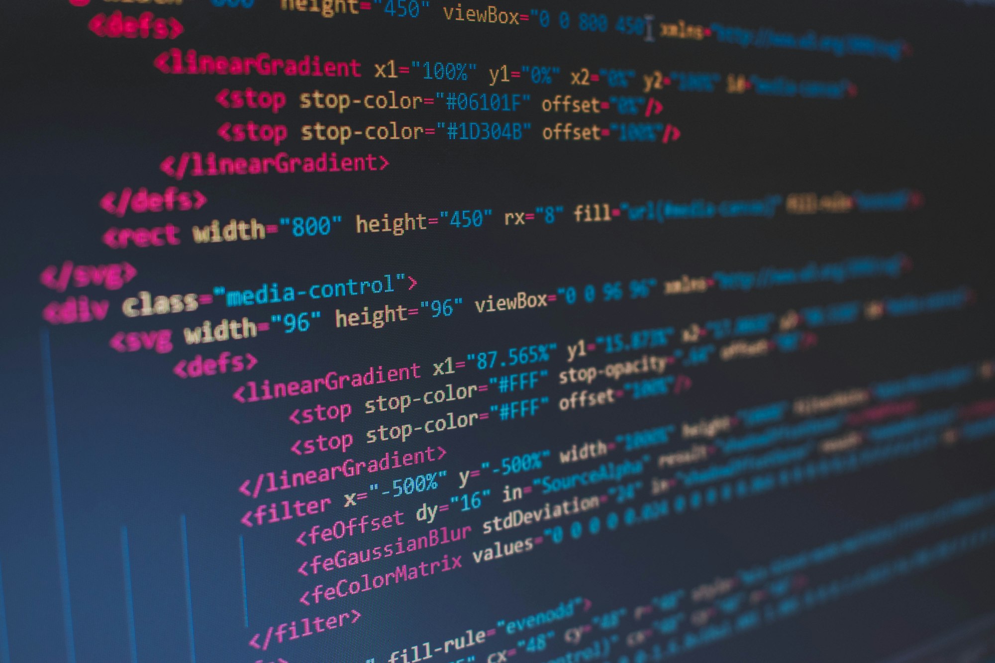 Lines of website code on a dark screen